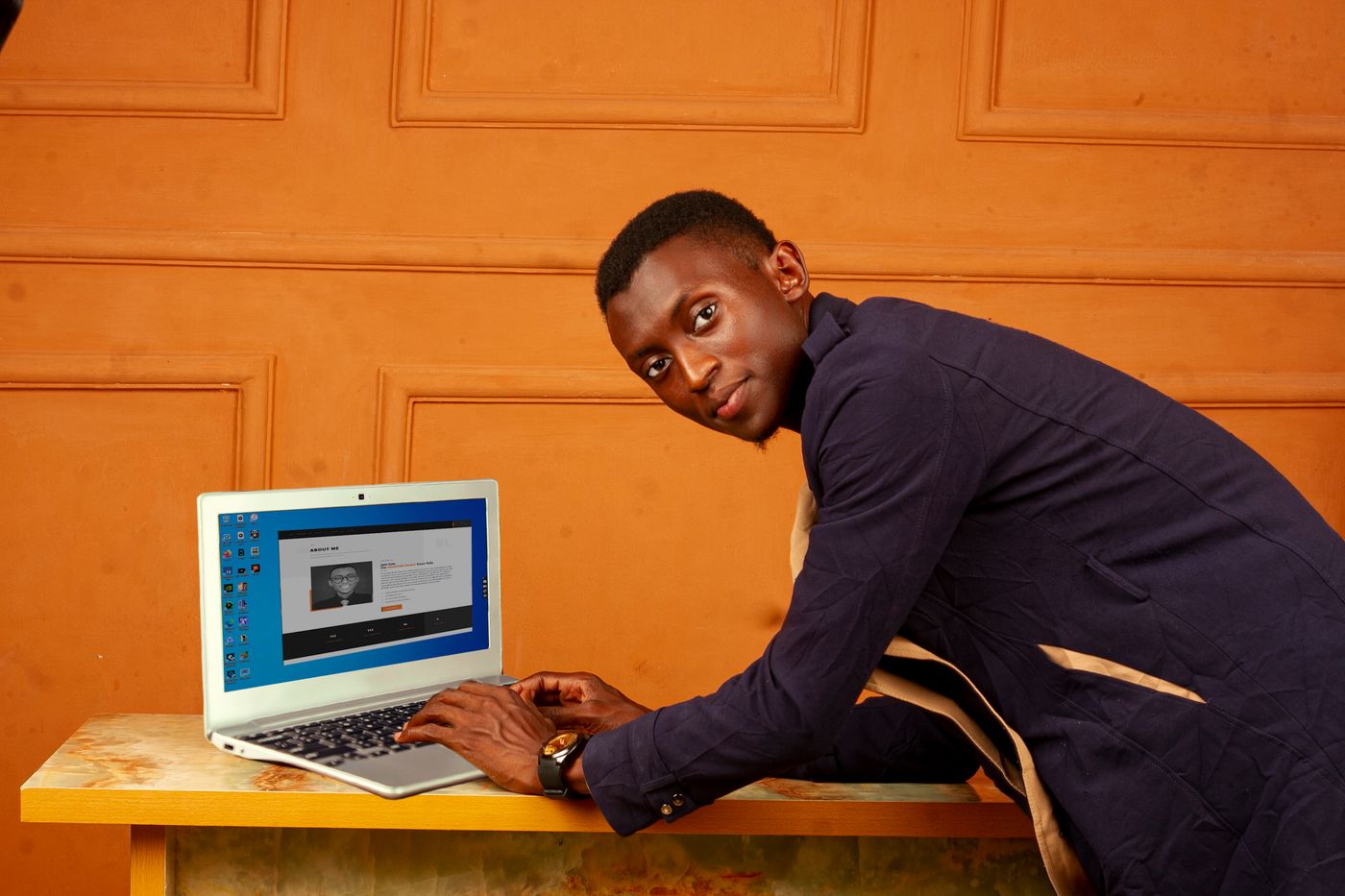 African business professional using a laptop in a modern office
