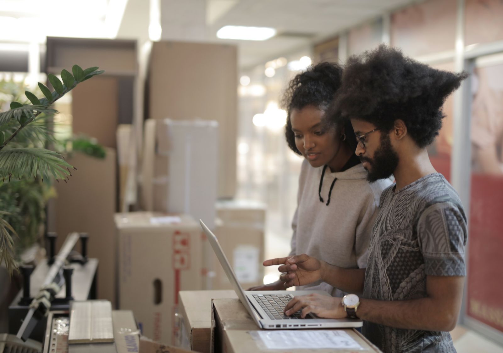 Black African business professionals collaborating on a laptop during website planning