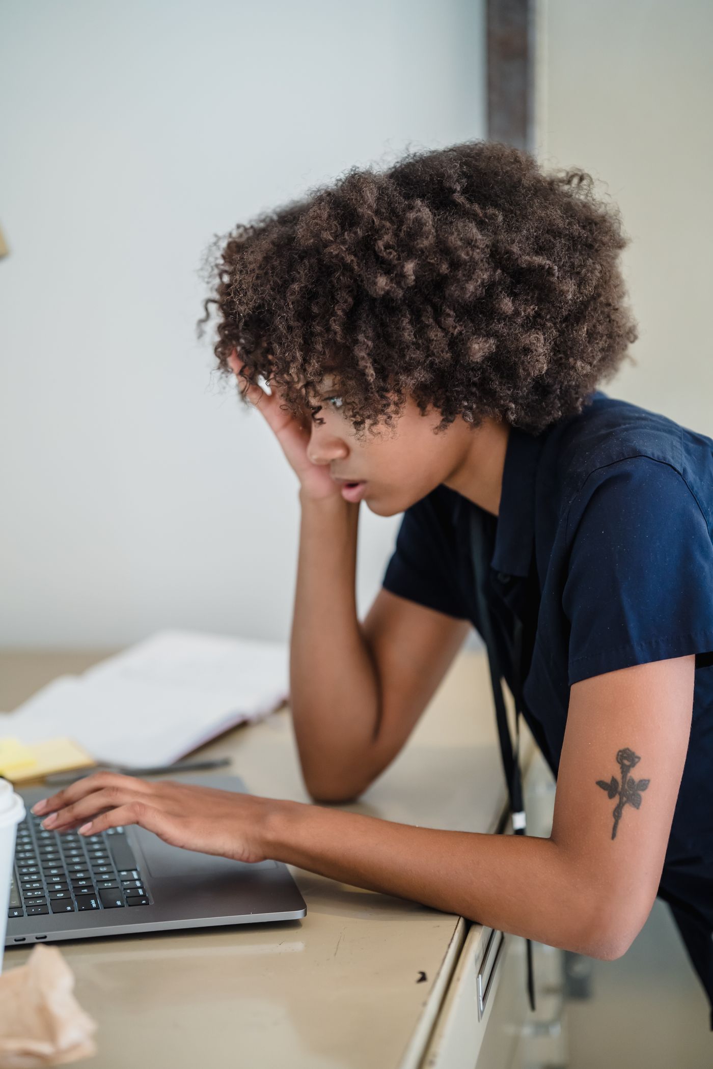 Black African businesswoman using a laptop in a modern office